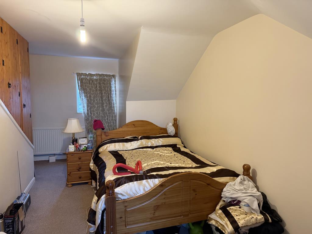 Bedroom on second floor with painted magnolia wall