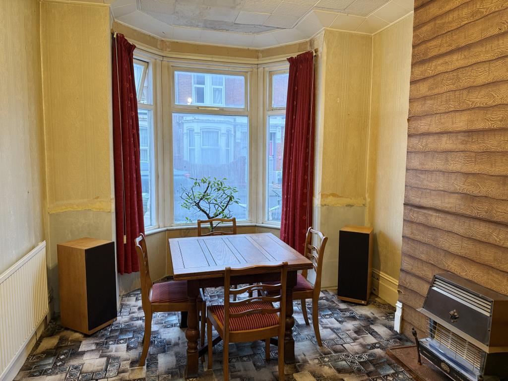 Living room with gas fire and pattern carpet