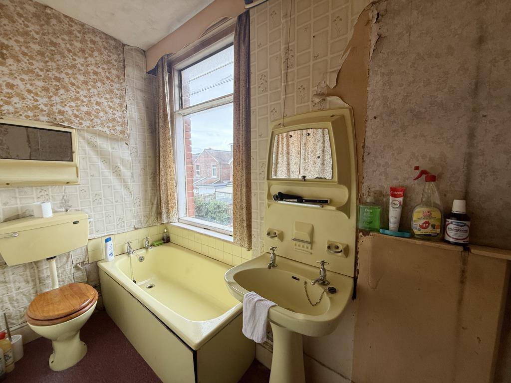 Bathroom with coloured suite