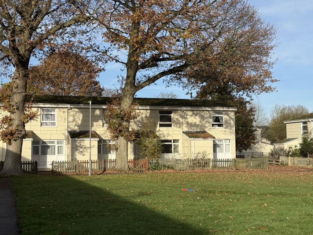 View across Green to House in Need of Improvement