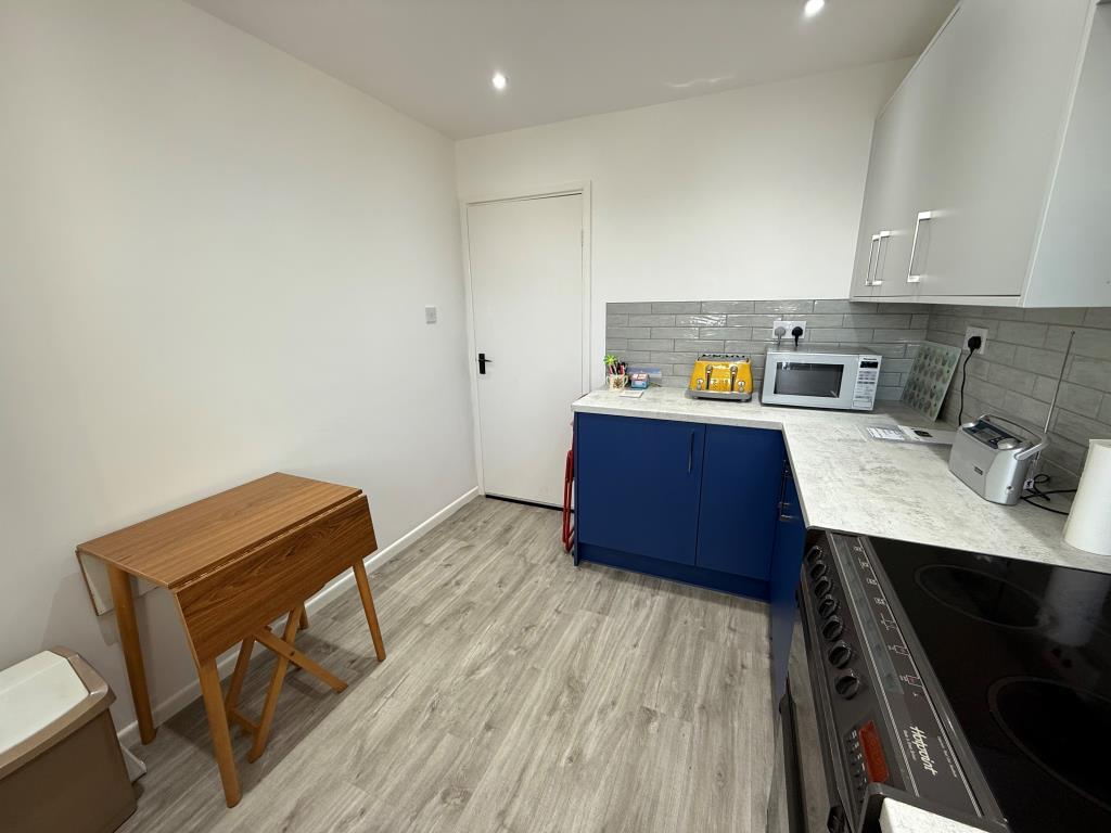 Other view of kitchen showing space for dining