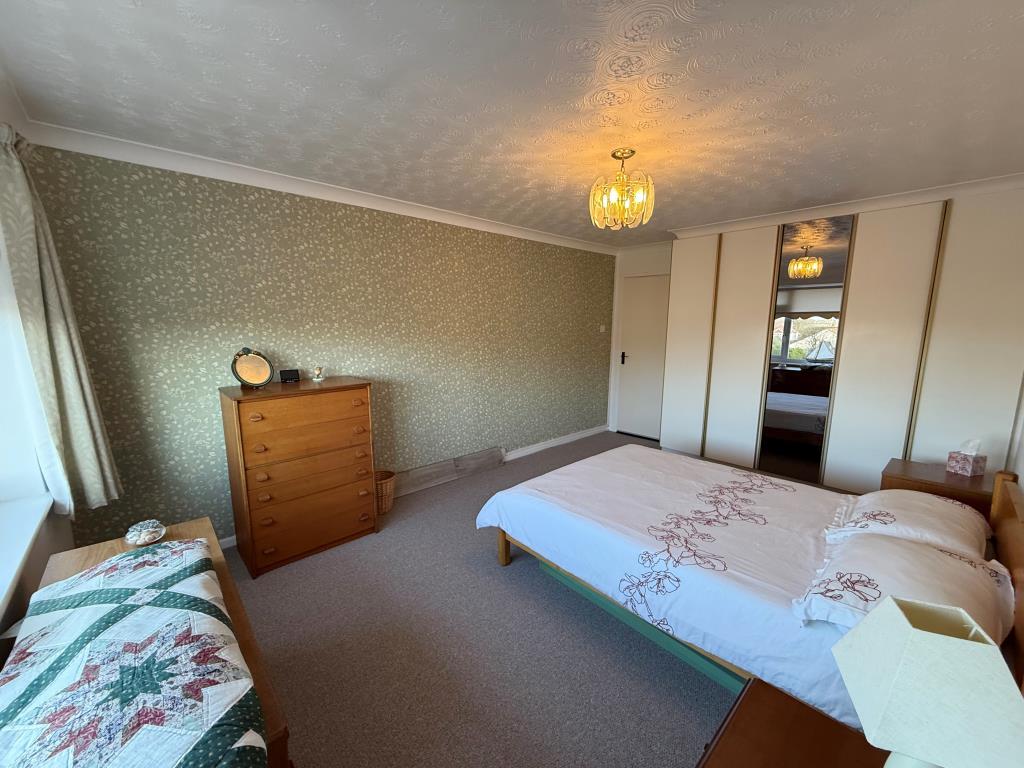 Other view of main bedroom showing fitted wardrobe