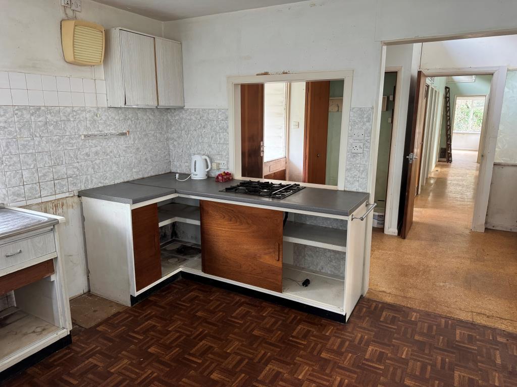 A View of the Kitchen and the Inner Hall Beyond