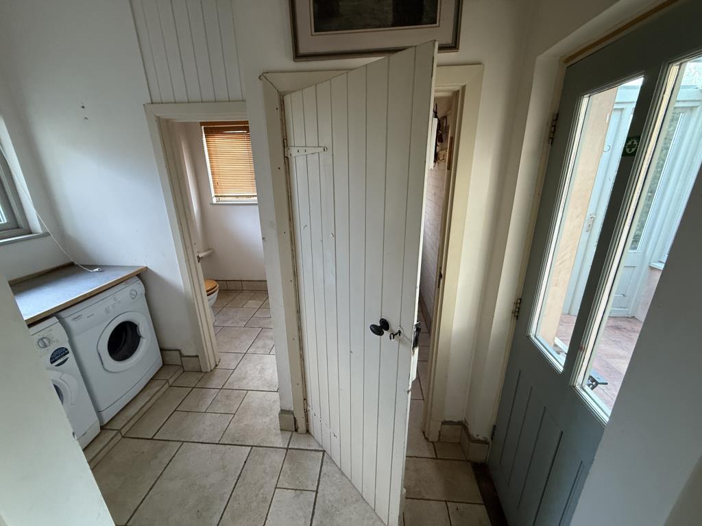 Utility room with walk in store