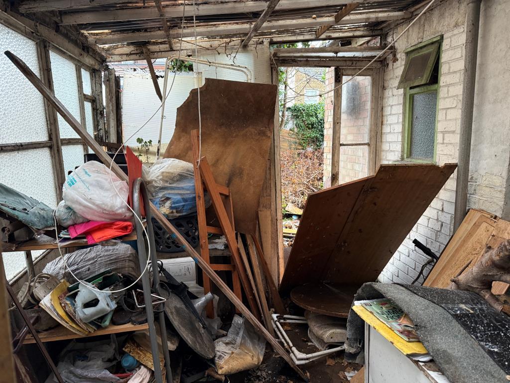 Dilapidated sun room on ground floor