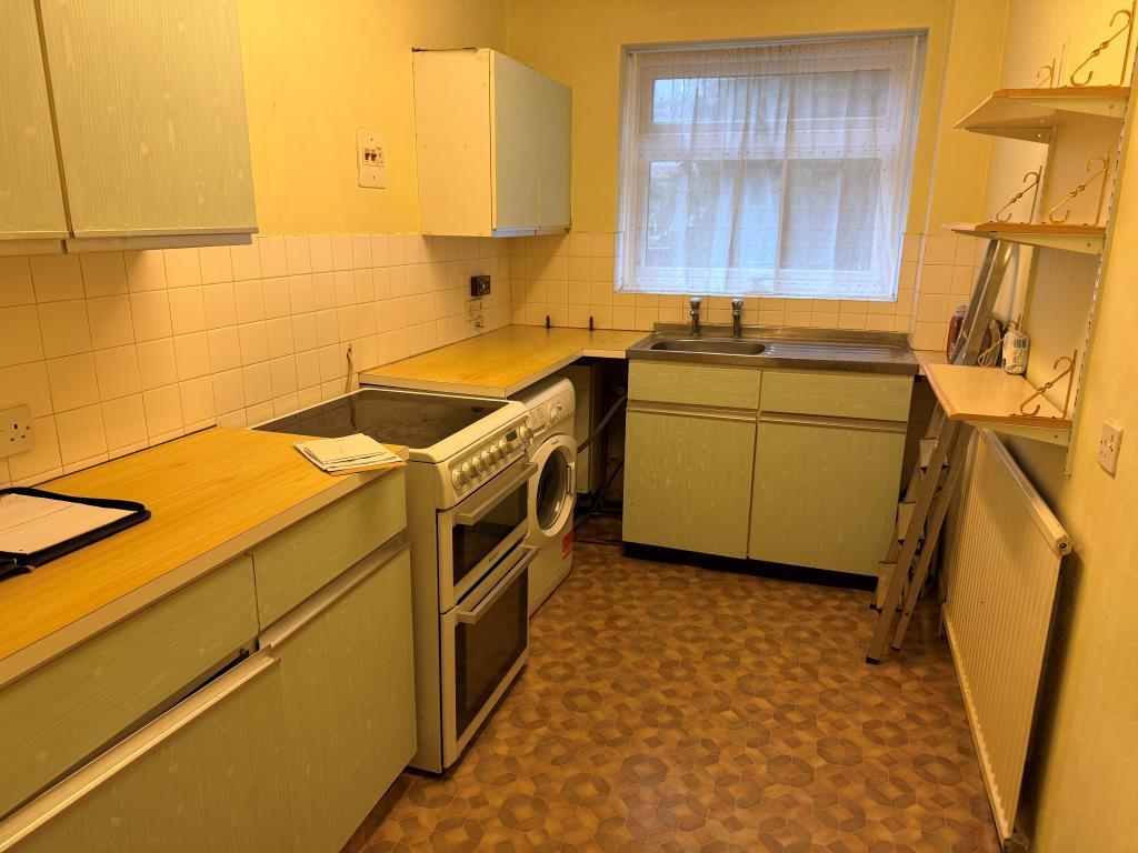 Fitted kitchen with window to front