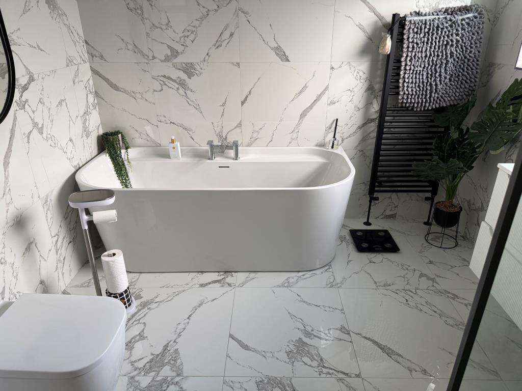 Family bathroom with white suite