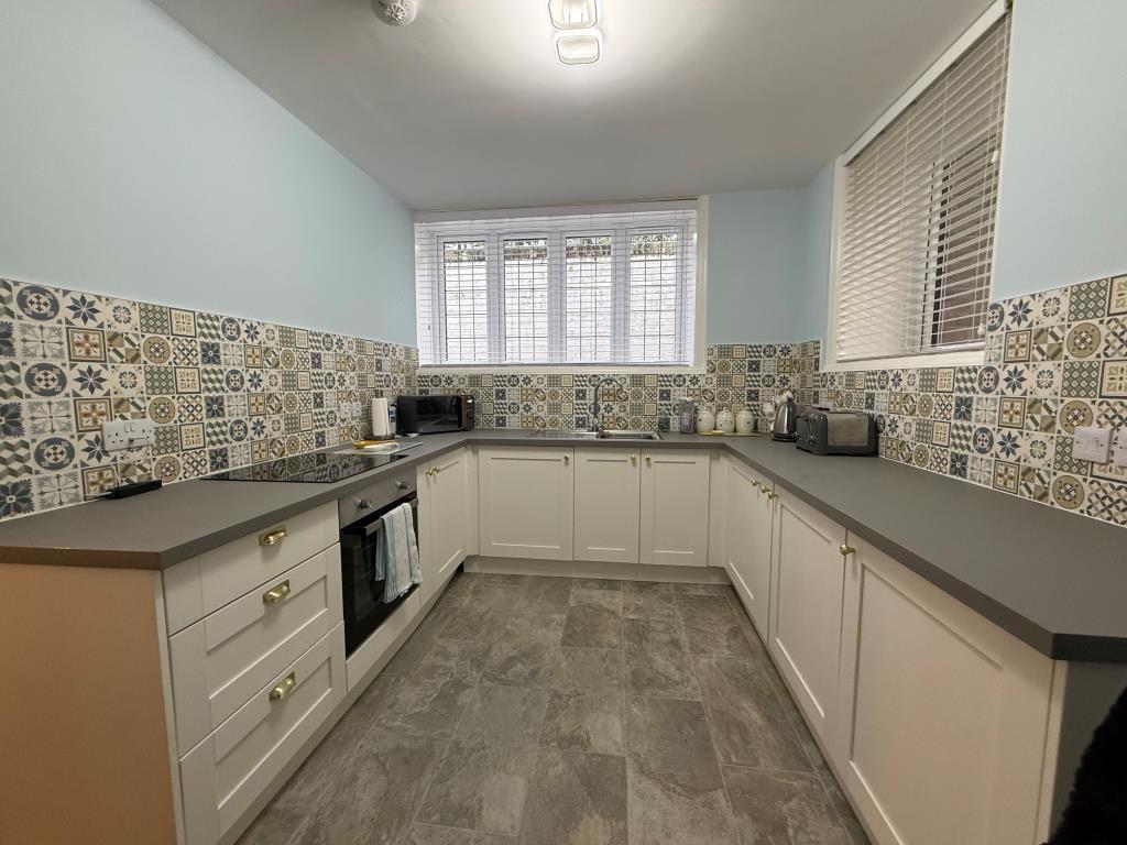 Tiled kitchen with dual aspect windows