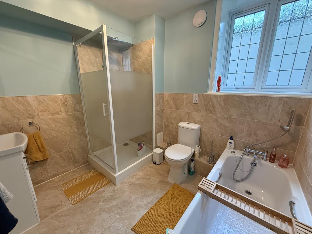 Bathroom including bath, shower and wc
