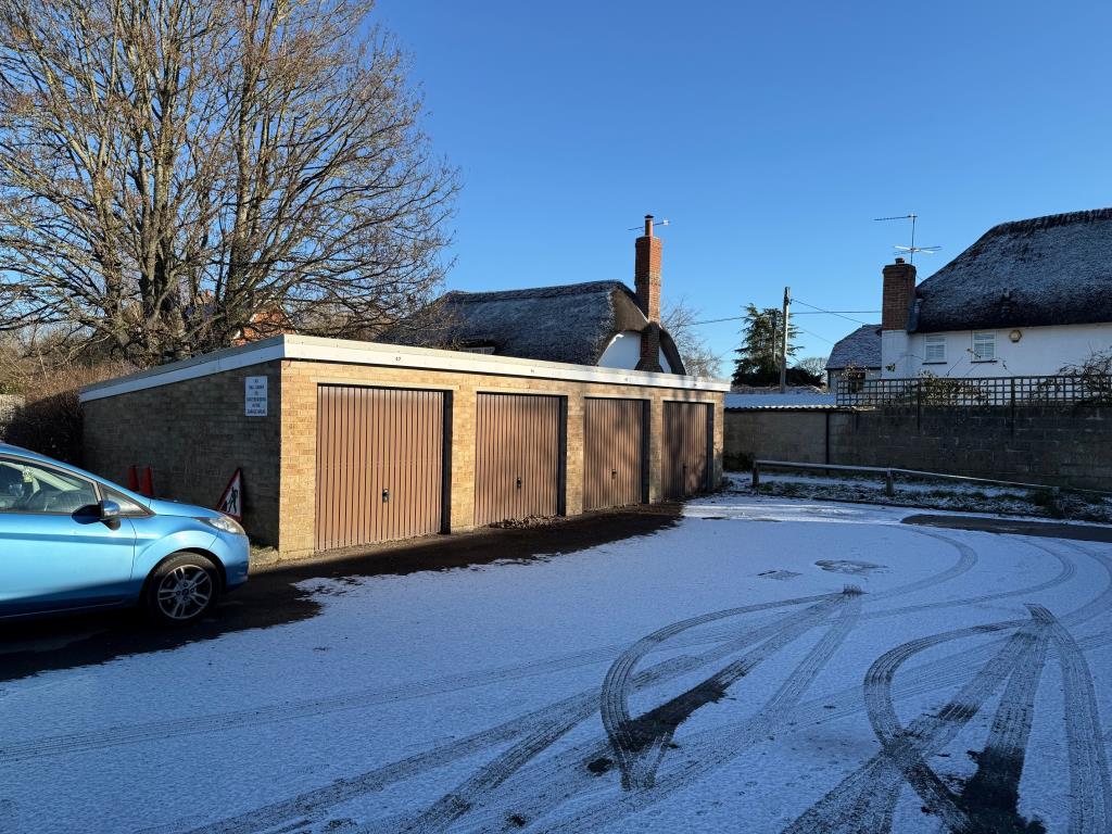 Block of four lock up garages