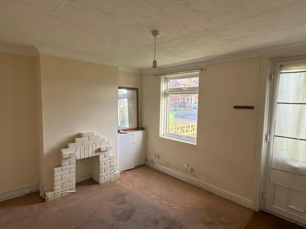 Living room with old fireplace