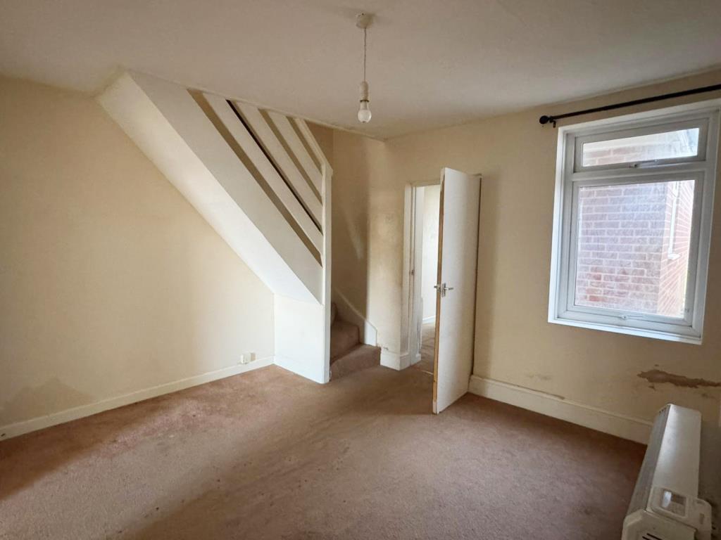 Dining room with stairs to one side