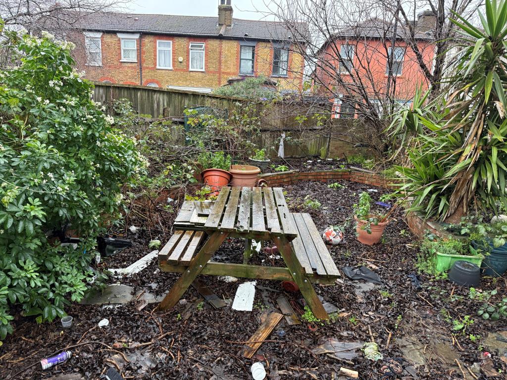Rear garden with patio area and seating