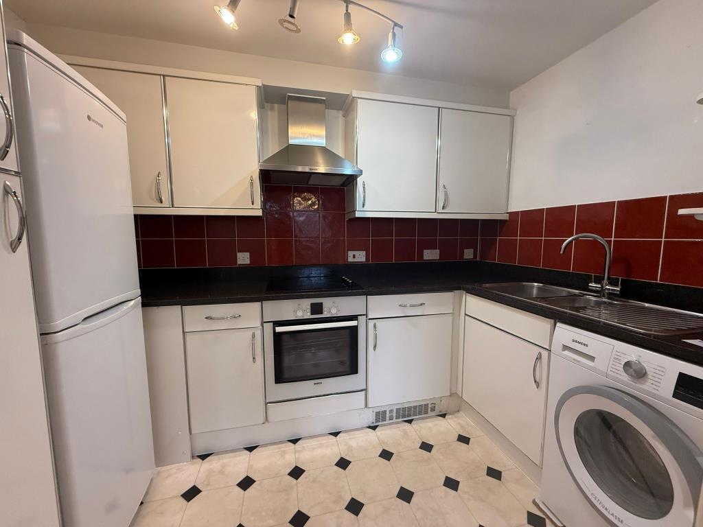 Kitchen with built in cupboards and appliances inc