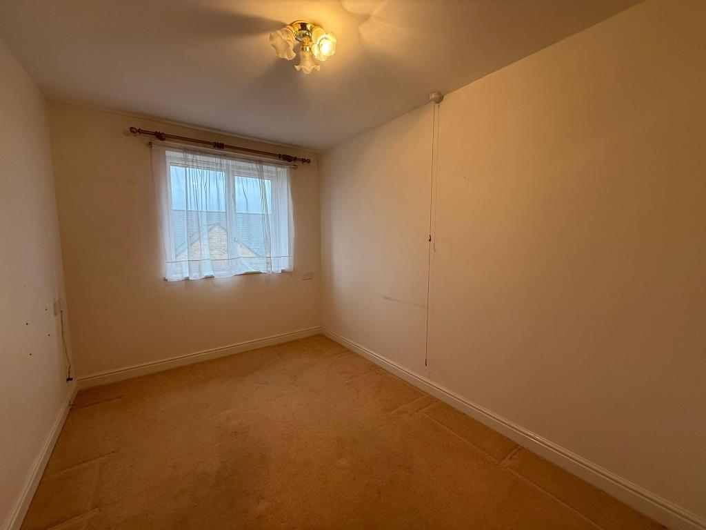 Carpeted 2nd bedroom with window