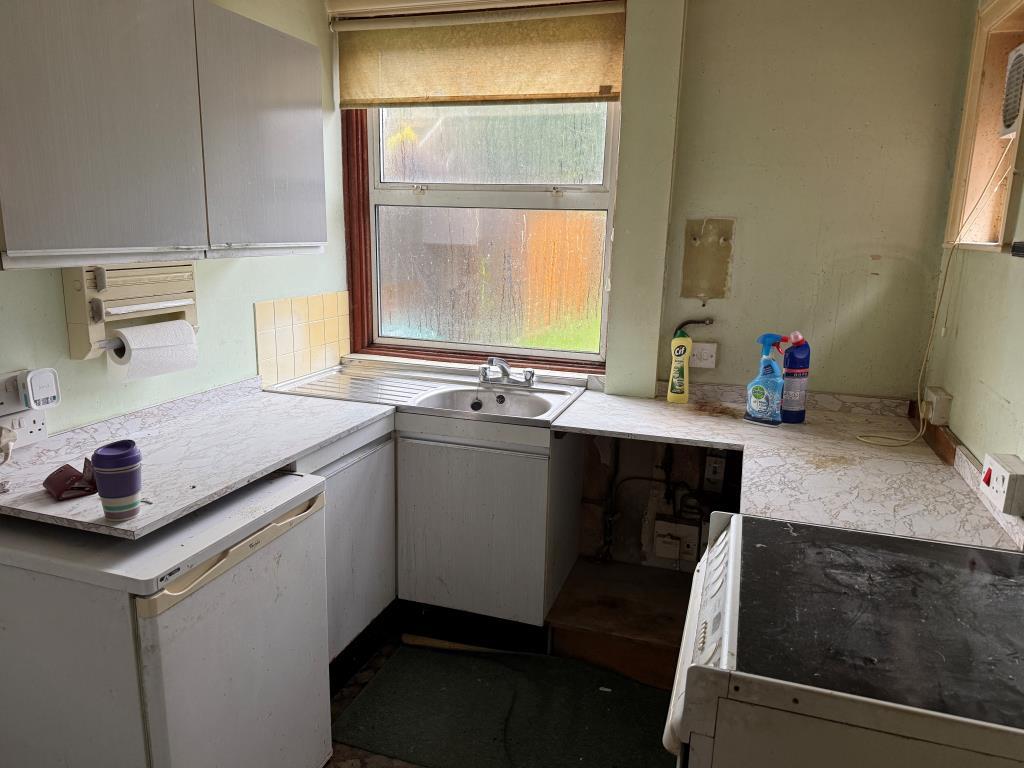 Kitchen to rear with fitted units and window