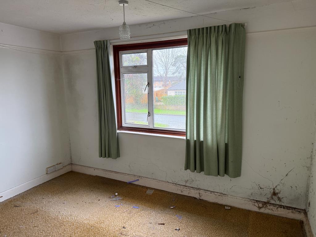 Third bedroom with front view over garden