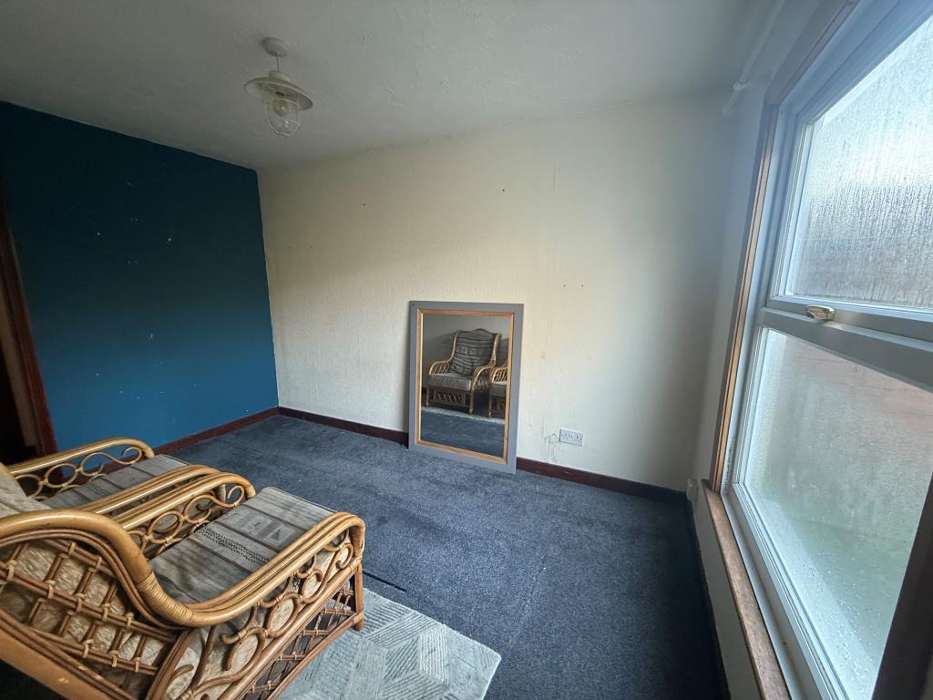 Carpeted dining room with window