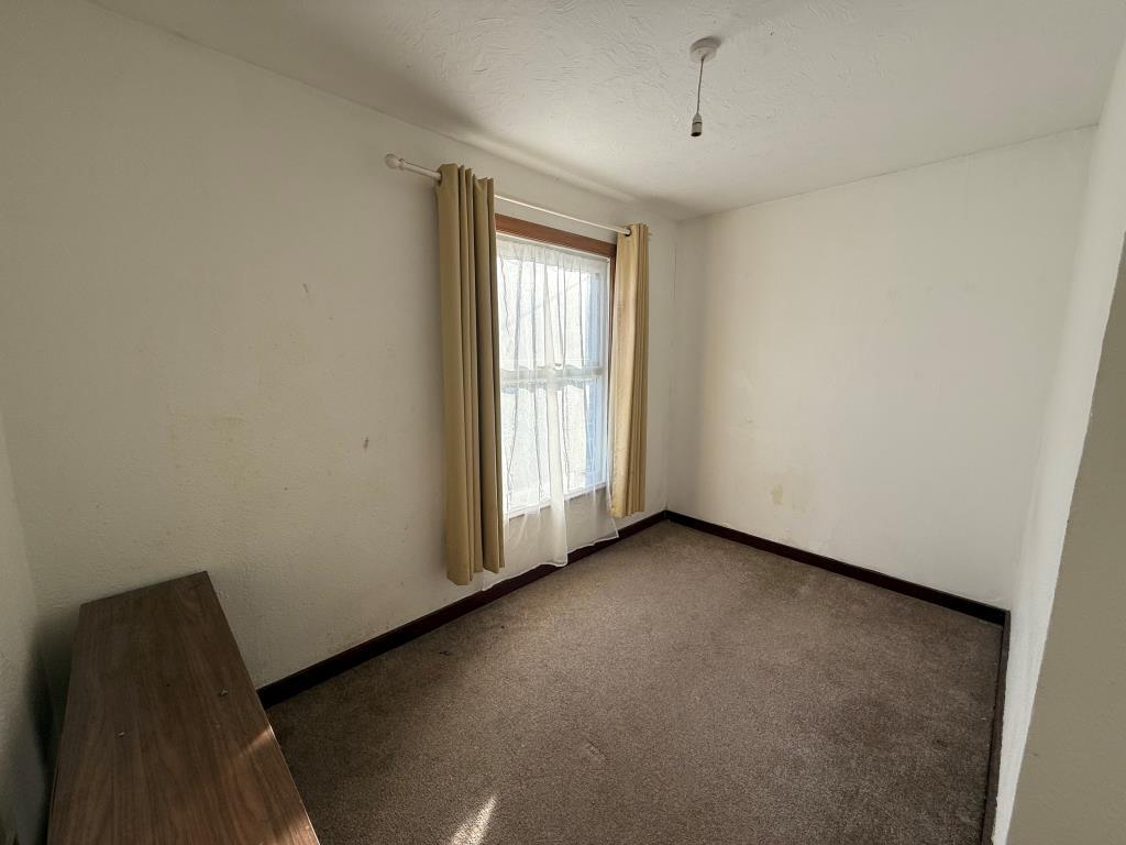 Carpeted 4th bedroom with window