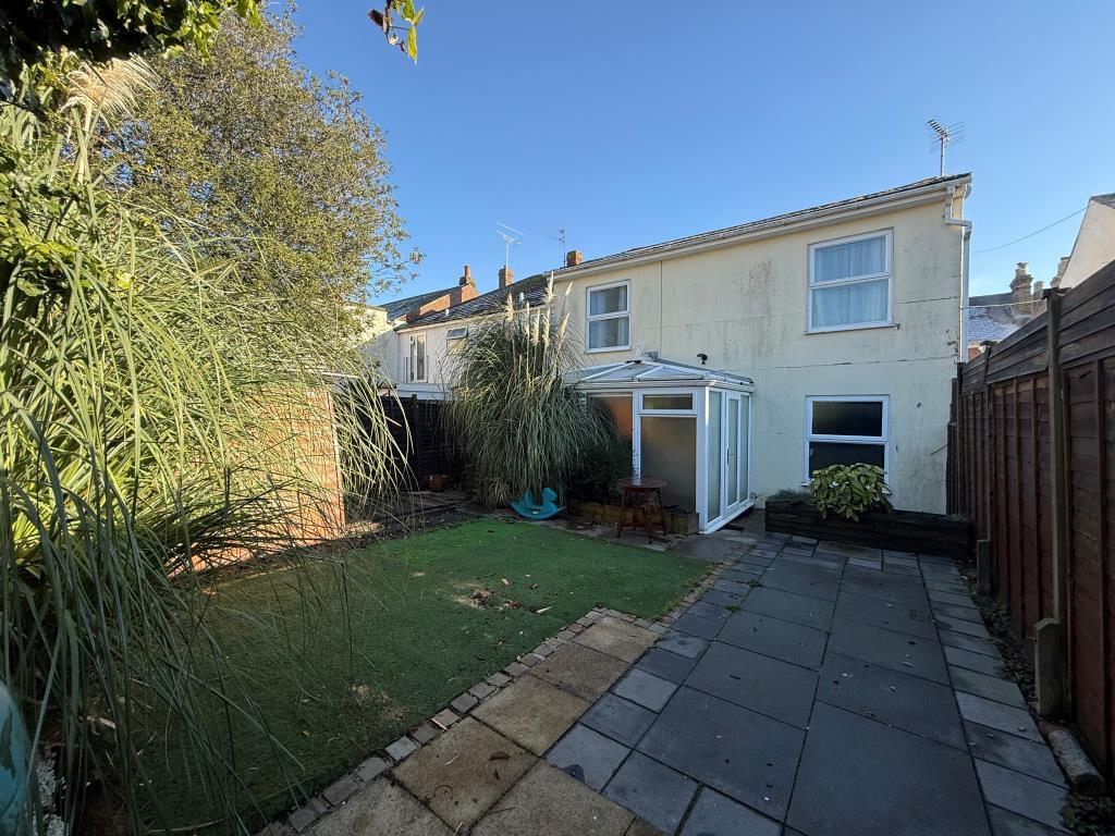 Back garden with astroturf showing back of house