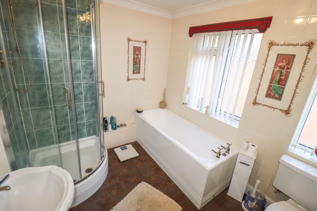 Bathroom with bath and shower cubicle