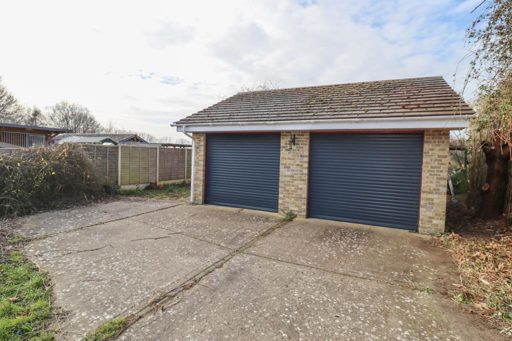 Detached double garage with electric doors