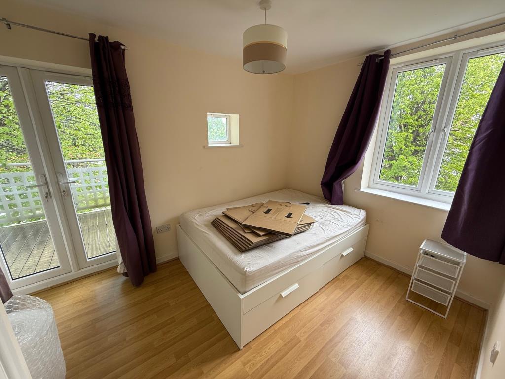 Bedroom with doors to balcony