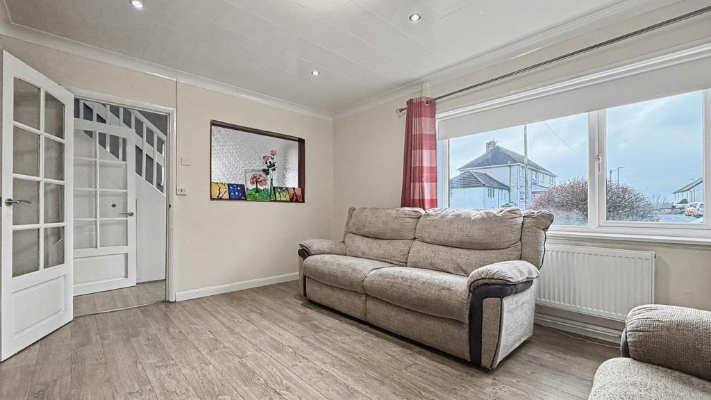 Bright, well-presented living room with large f...
