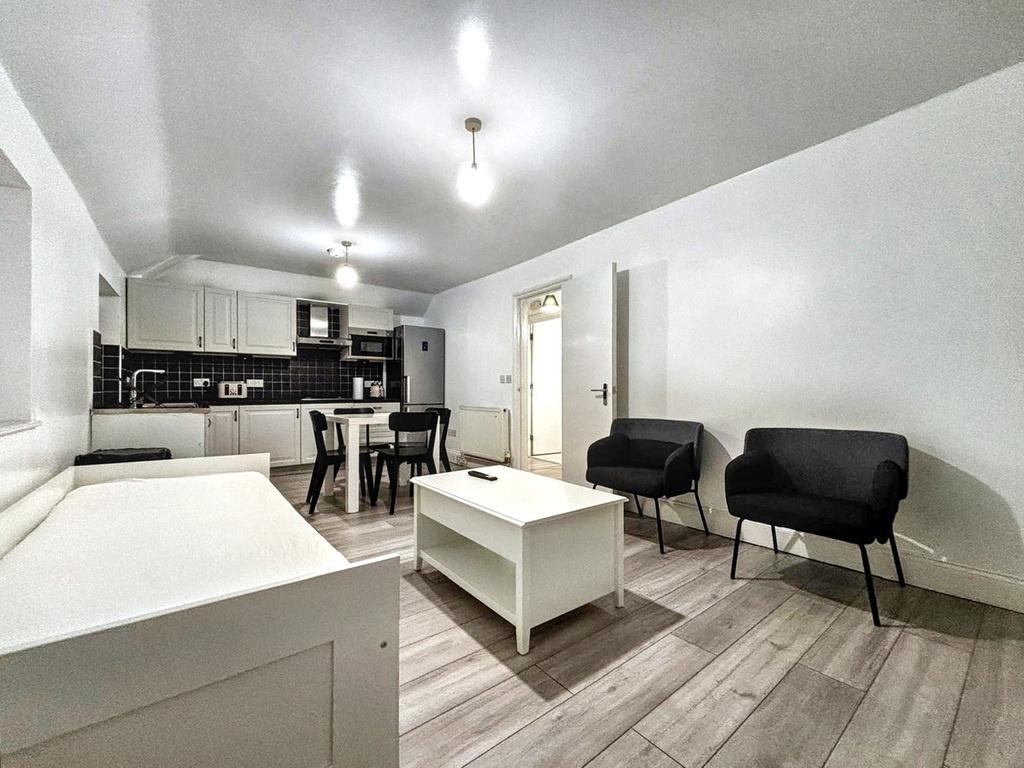 Bright, modern open-plan living area with conte...