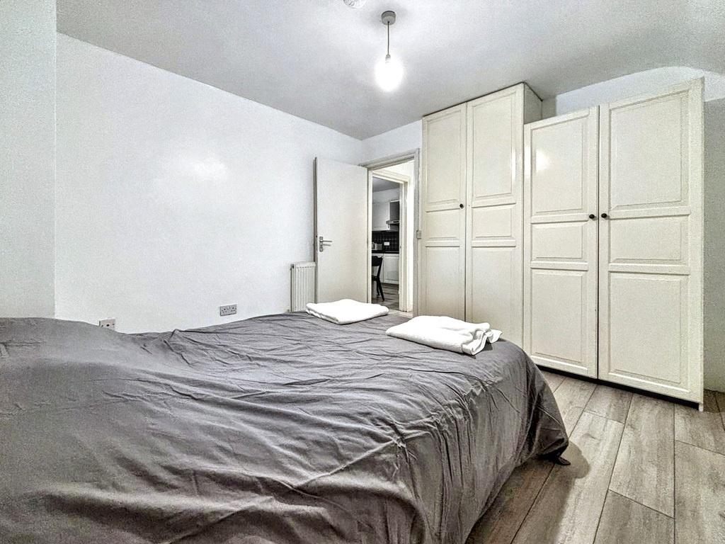 Bright, neatly presented bedroom with a double ...