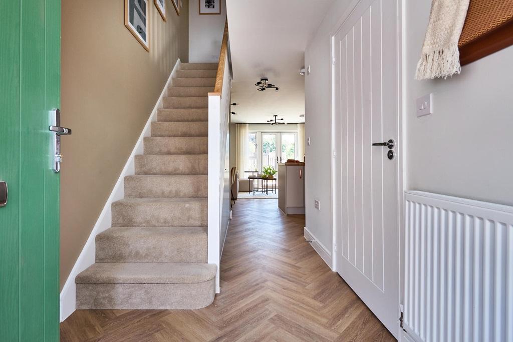 Spacious and bright hallway with views through...