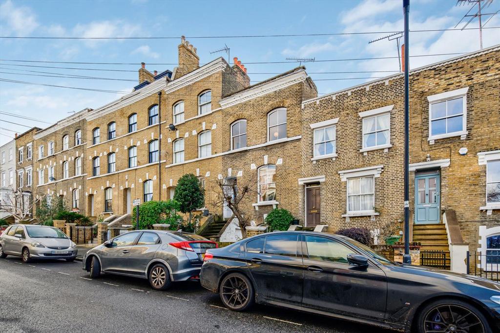 Street scene with property, parking