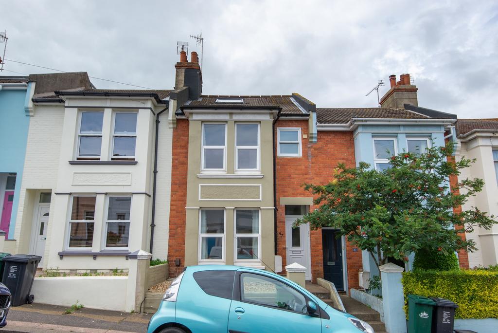 Attractive terraced house façade with bay windo...