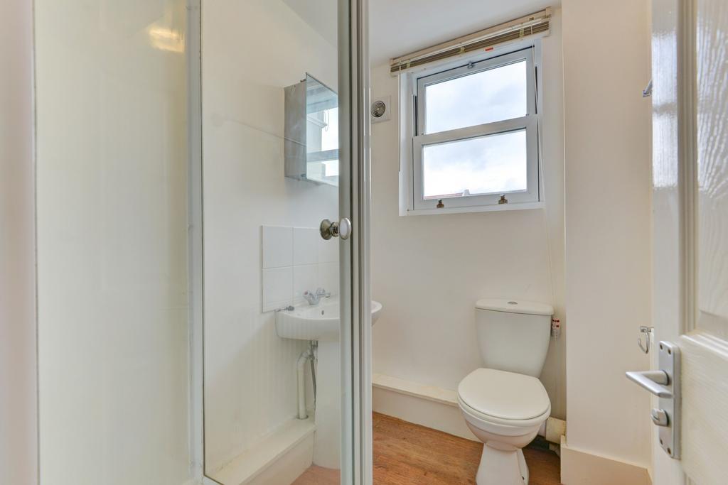 Bright, well-maintained bathroom featuring a co...