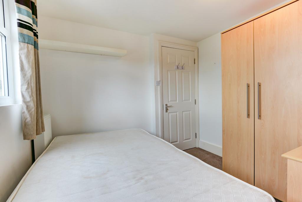 Bright, neatly presented bedroom with a comfort...