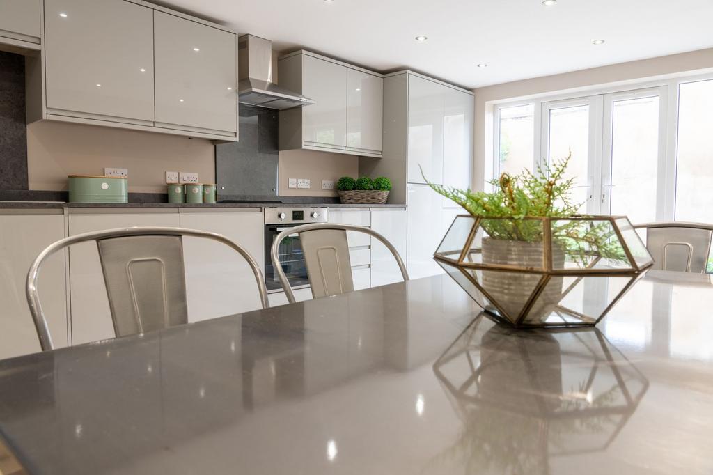 Bright, modern kitchen with high-gloss cabinets...