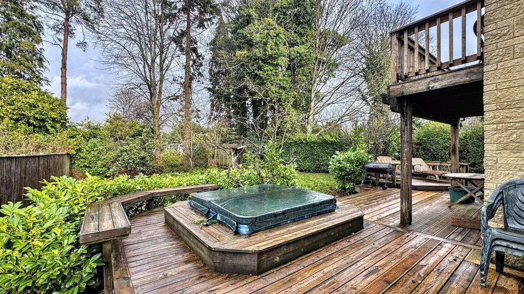 Well-kept private garden with a spacious wooden...