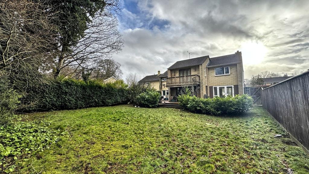 Spacious, well-kept rear garden with a large la...