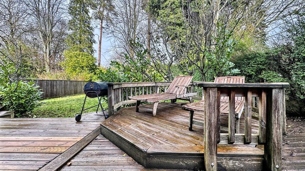 Spacious private garden with a multi-level wood...