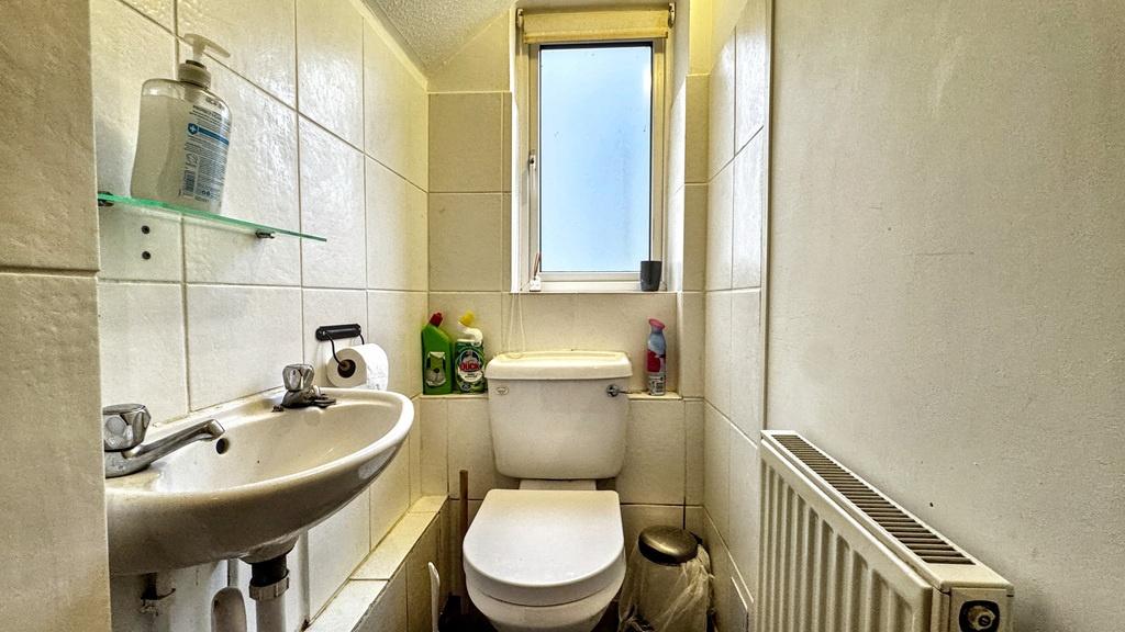 Bright, tidy bathroom with a modern pedestal si...