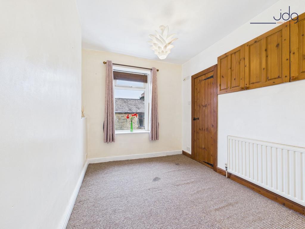 Double Bedroom with walk in wardrobe and storage