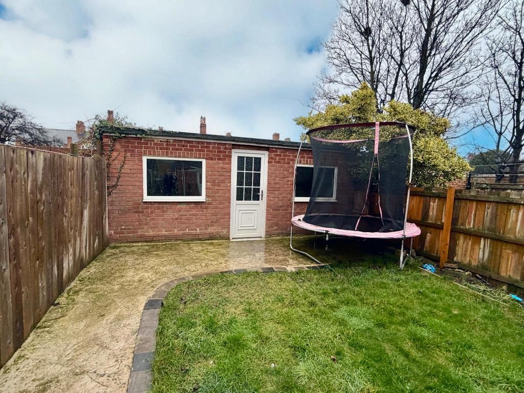 Rear Garden leading to Garage