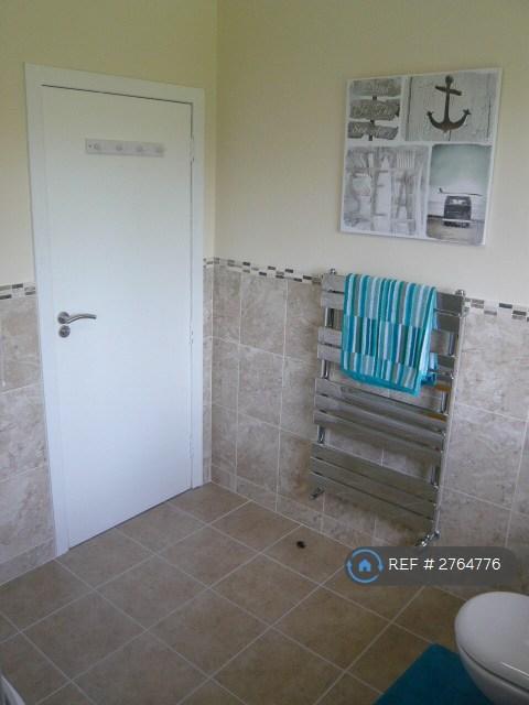 Chrome Towel Radiator, Tiled Walls And Floor