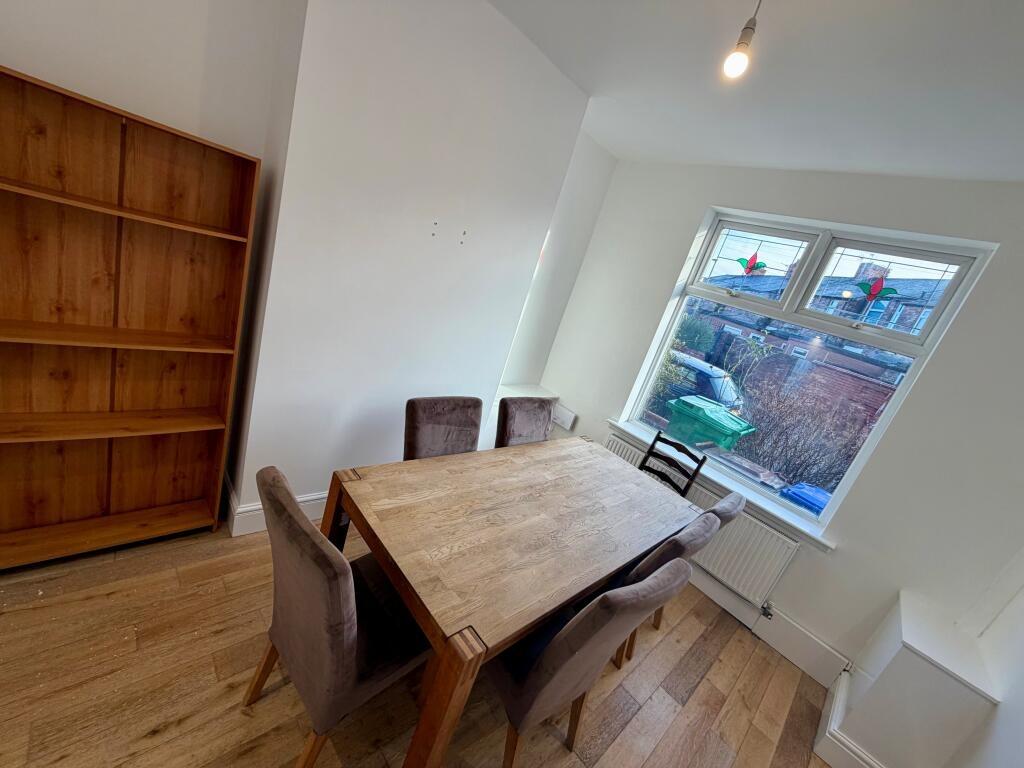 Bright, neutrally decorated living/dining room ...
