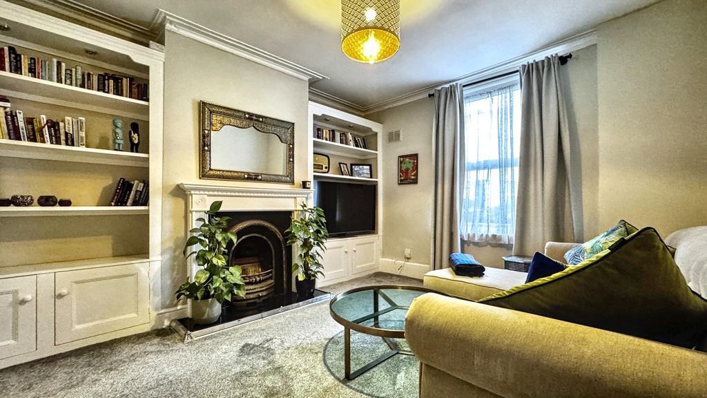Bright, well-presented living room with a featu...