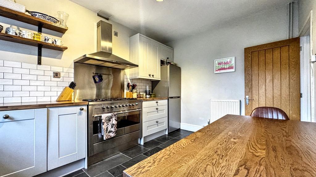 Bright, modern fitted kitchen with subway tile ...
