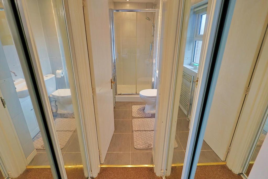 Wardrobes into En-suite