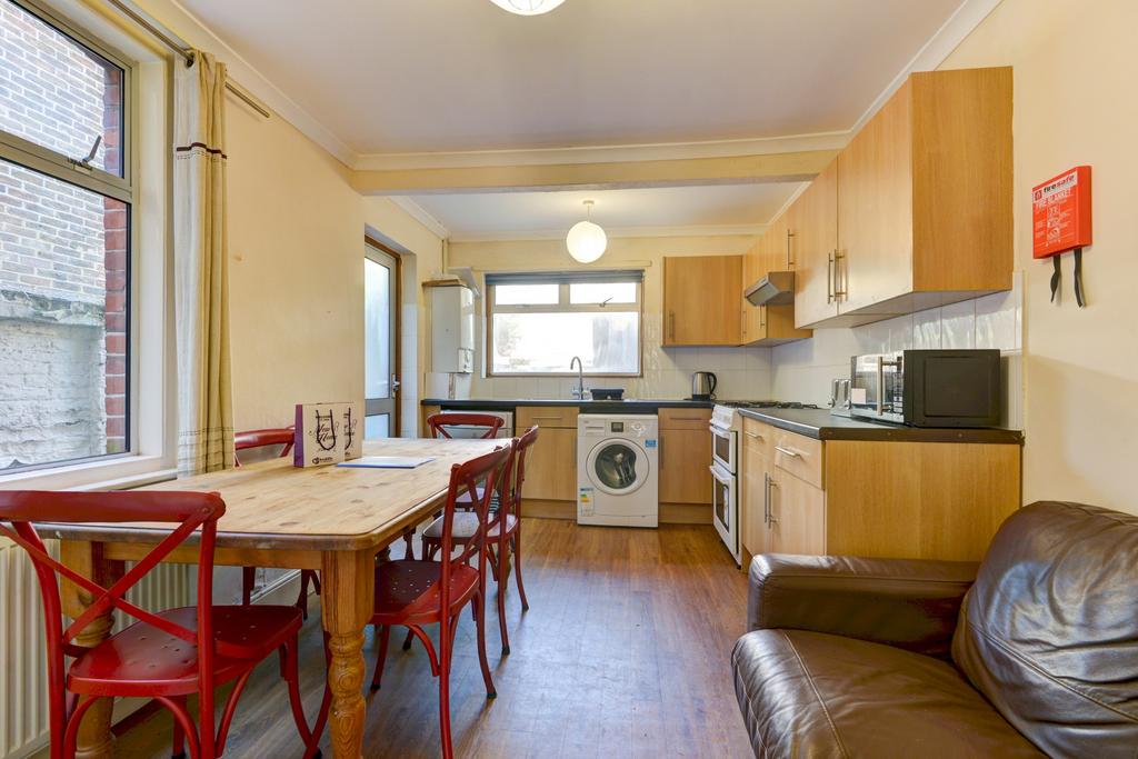Bright open-plan kitchen with a dining table an...