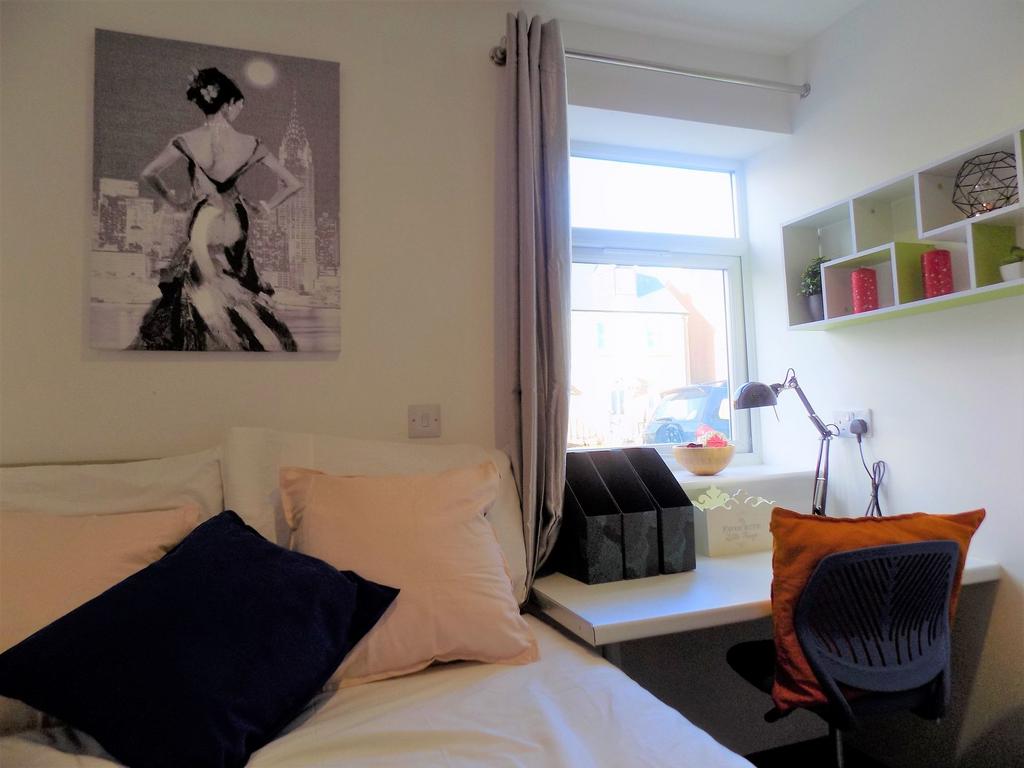 Well-presented bedroom with a comfortable bed, ...