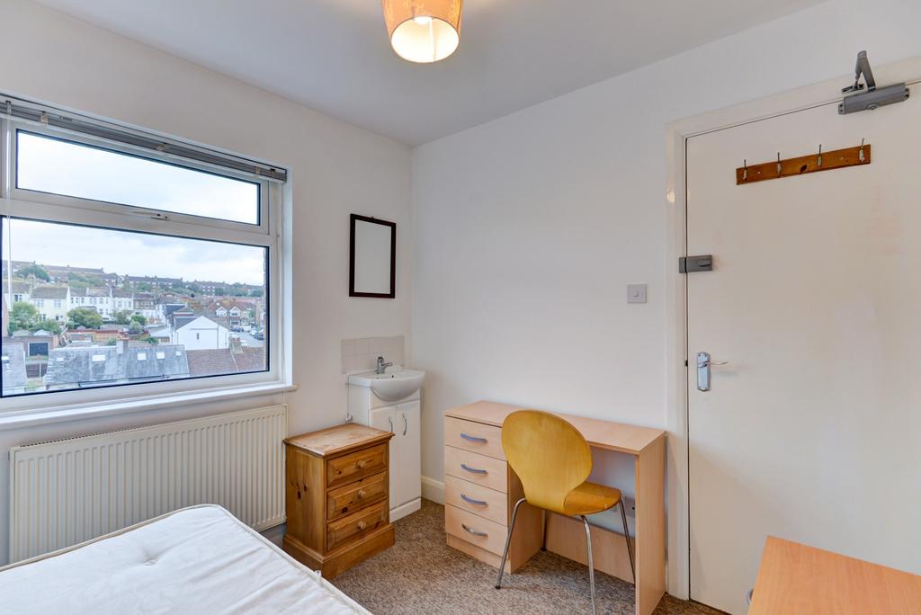 Bright, tidy bedroom with a large window offeri...